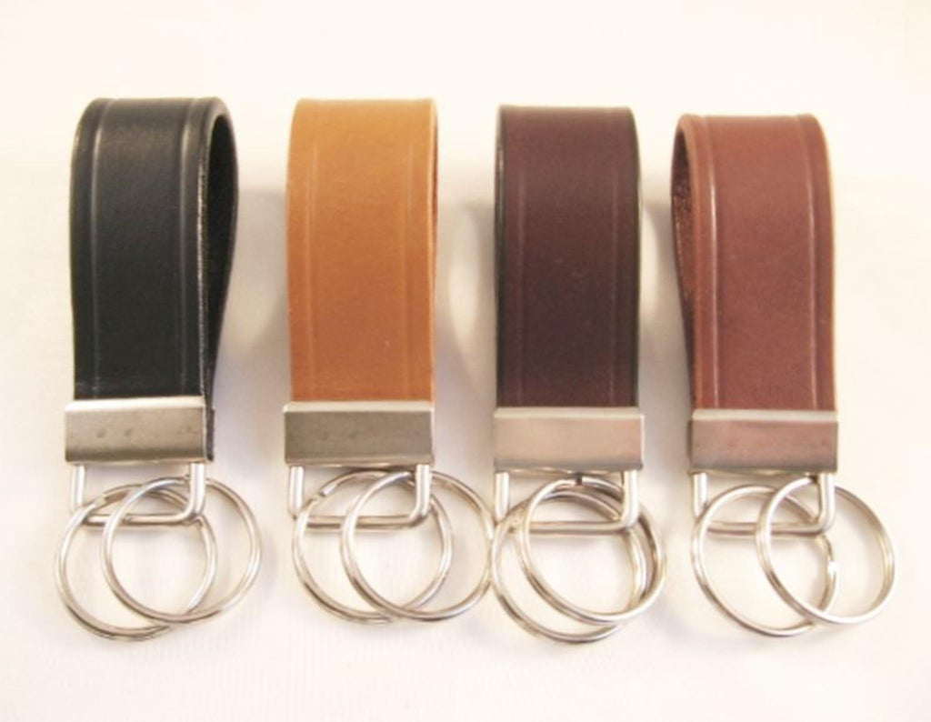 Choice of leather keychains in black, brown, and tan colors with metal key rings.