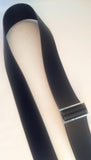 Black strap  with a silver buckle on a white background