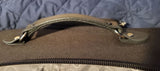 Photo of our handle a brown leather replacment handle on an overnight bag