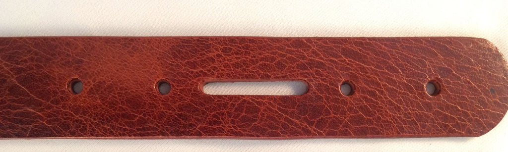 Antiqued brown leather belt blank strip with a distressed finish, showing the texture and color uniformity.  Edges rounded and painted to match finish.