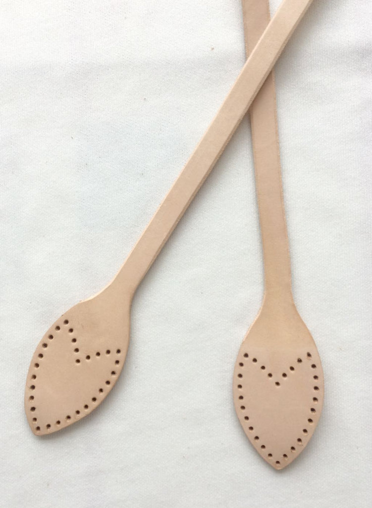 A collection of leather replacement straps for Neverful in beige, brown, black, and dark brown colors